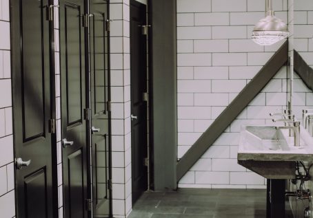 photo of bathroom with doors that go all the way to the ground